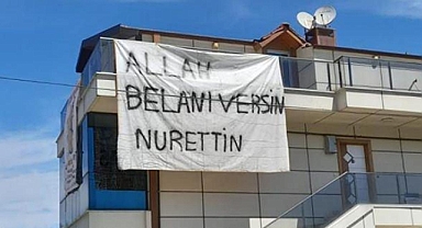 Binaya asılan dev pankartı gören dönüp bir daha baktı